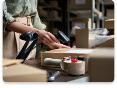 a woman scanning a parcel for clearing