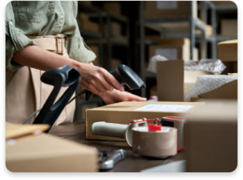 a woman scanning a parcel for clearing